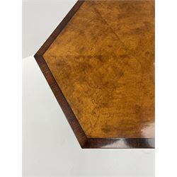 Regency style birdseye maple and rosewood tripod table, hexagonal tilt top with segmented veneer and banding, tapered hexagonal column on three splayed serpentine supports, brass cups and castors 