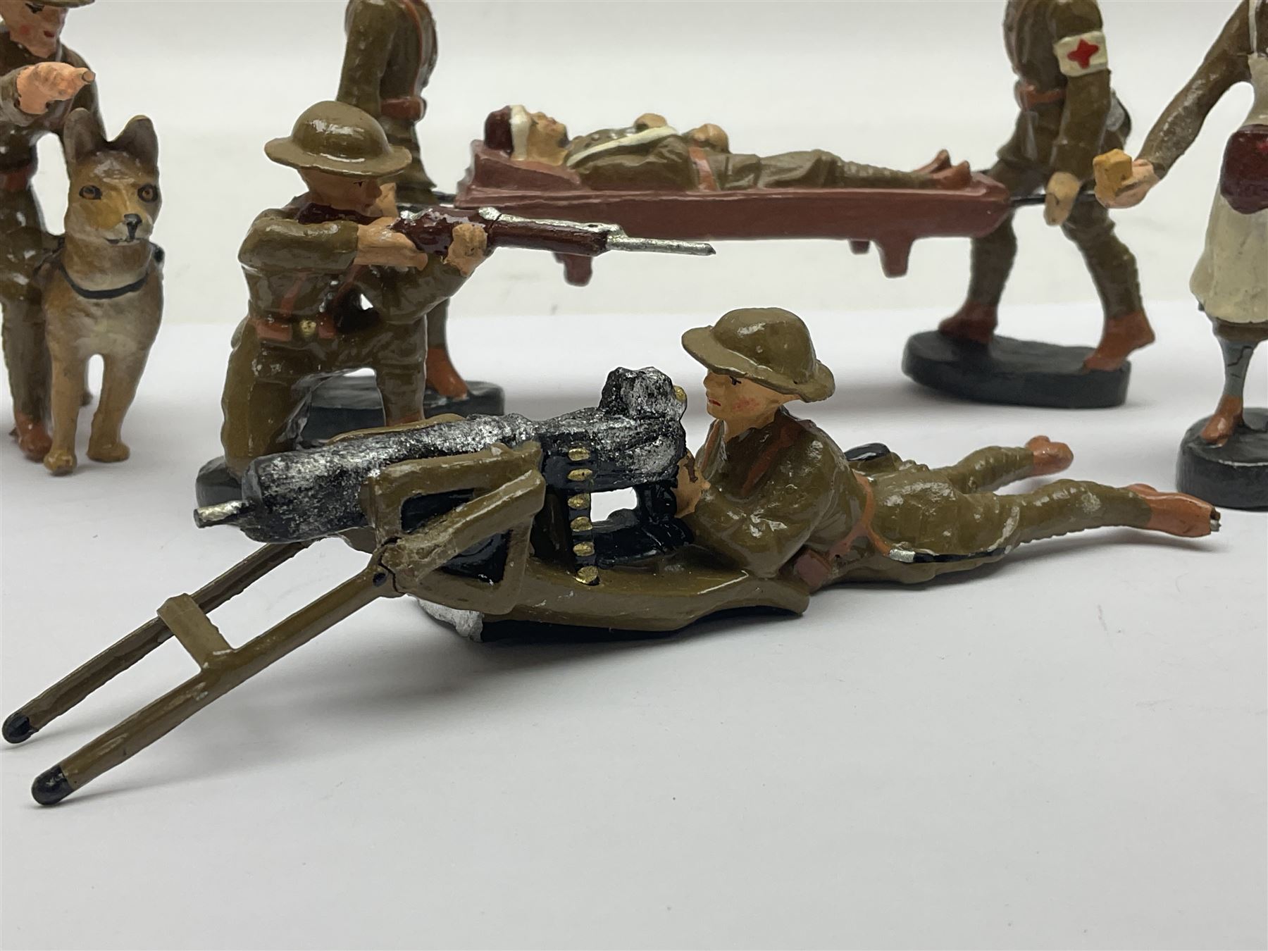 Eight Elastolin British soldiers and wartime figures, including nurse, injured soldier on stretcher, soldier with dog, etc, tallest 11cm