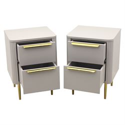 Made.com - 'Ebro' pair of grey bedside chests, gold painted metal shaped handles, rounded corners with fluted detail, raised on gold painted metal tapered supports