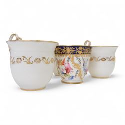 Coalport teawares, circa 1820-1840, comprising set of four trios, coffee cups, teacups and saucers, and slop bowl, decorated in the 830 pattern, with floral sprays and gilt shaped reserves, two further coffee cups and saucers, decorated with floral sprays upon blue grounds/with blue borders, and a similar coffee cup