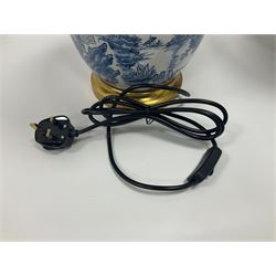 Pair of Chinese table lamps of baluster form, each decorated with landscape scene, raised upon gilt circular base, including shade H63cm