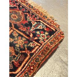 Persian Heriz red ground carpet, the field decorated with all-over geometric floral design within a guarded border, second quarter of the 20th century, 238cm x 339cm. - COLLECTION BY APPOINTMENT FROM: The White House, Thirsk Road, Easingwold, York, YO61 3NF - CALL 01723 507111 TO ARRANGE