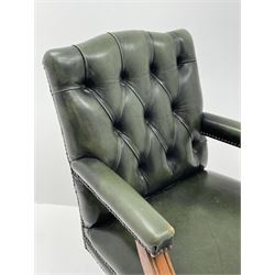 Late 20th century swivel office desk chair upholstered in green buttoned leather