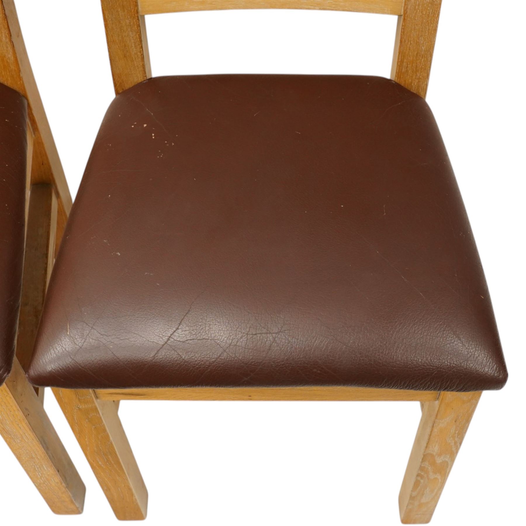 Late 20th century solid light oak refectory style dining table, rectangular top raised on square supports united by stretcher (W180cm D100cm H81cm); Set of six light oak high-back dining chairs with burgundy leather seats (W49cm H109cm)