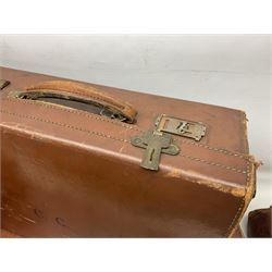Early 20th century tan leather Gladstone bag, bearing initials GAH to one side, together with a similar smaller example and four vintage tan leather suitcases, two with impressed initials, largest including handle H37cm (6)