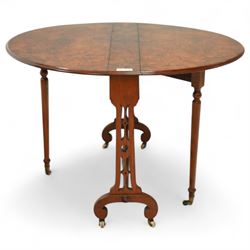 John Taylor & Son, Edinburgh - Late Victorian Aesthetic style walnut Sutherland table, with a hinged oval top on fret carved support, stamped John Taylor & Son Edinburgh, supported by scrolled feet on ceramic castor (Extended 105cm)