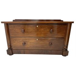 Victorian mahogany chest, raised back, fitted with two deep drawers with bone escutcheons, flanked by half-canted inset pilasters, on compressed bun feet