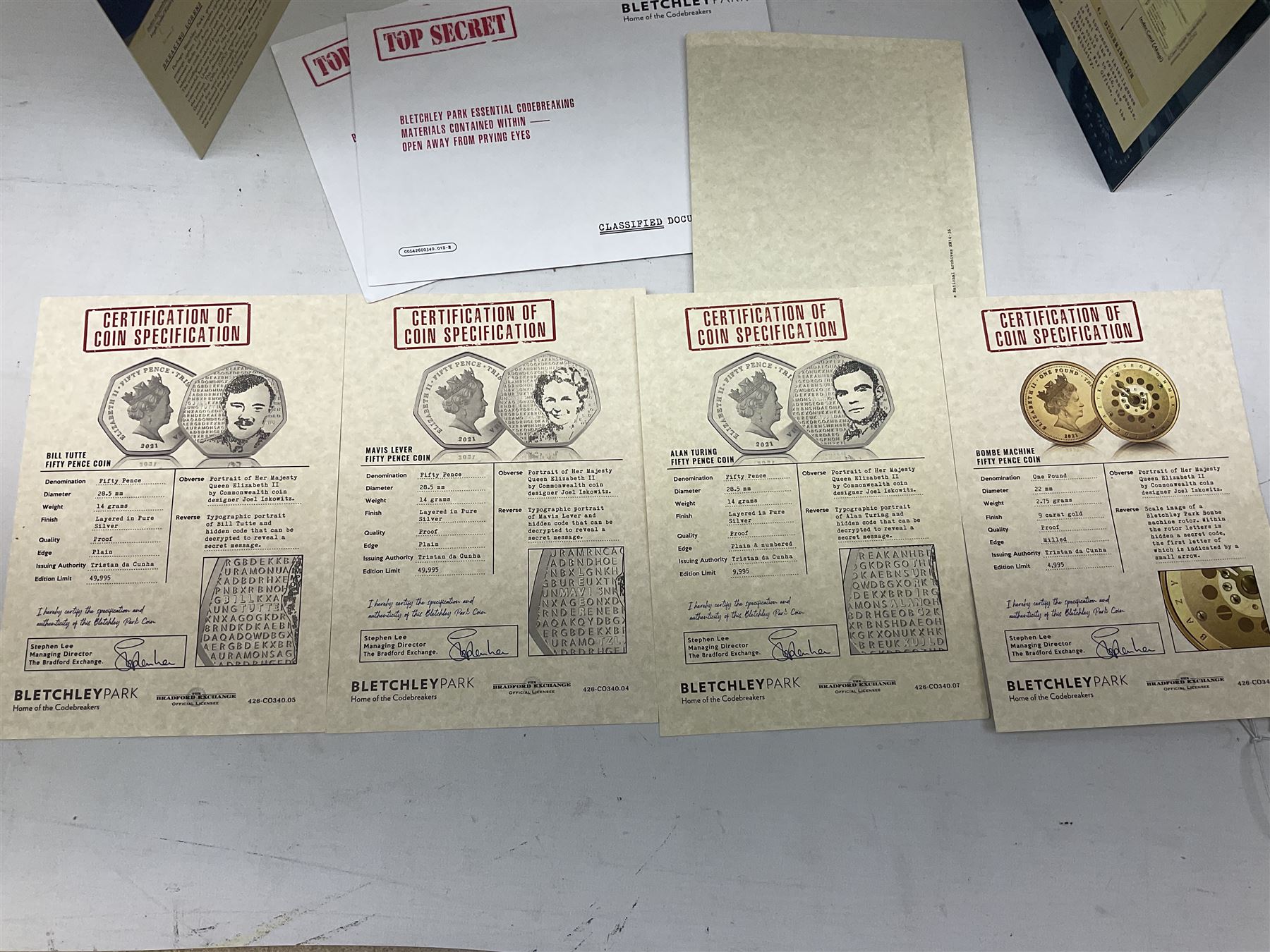 Queen Elizabeth II Tristan Da Cunha 2021 Bletchley Park seven coin set, including 'Bombe Machine' 9ct gold coin weighing 2.75 grams, housed in a presentation folders with certificates