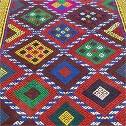 Central Asian Suzani kilim flatweave runner, decorated with a repeating diamond lattice enclosing polychrome geometric motifs within yellow key fret borders, fringe ends 
