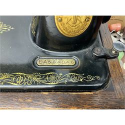 Singer sewing machine no. EA584046 in case (missing key) and Singer Manual of Family Sewing Machines