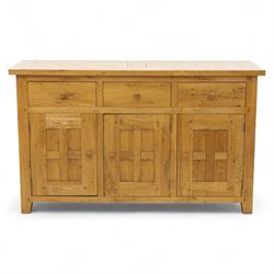 Contemporary solid oak sideboard, rectangular plank top above three drawers and three panelled cupboard doors, fitted with wooden knop handles