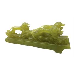 Green stone figural group depicting three lions, upon an inclined base, L21cm