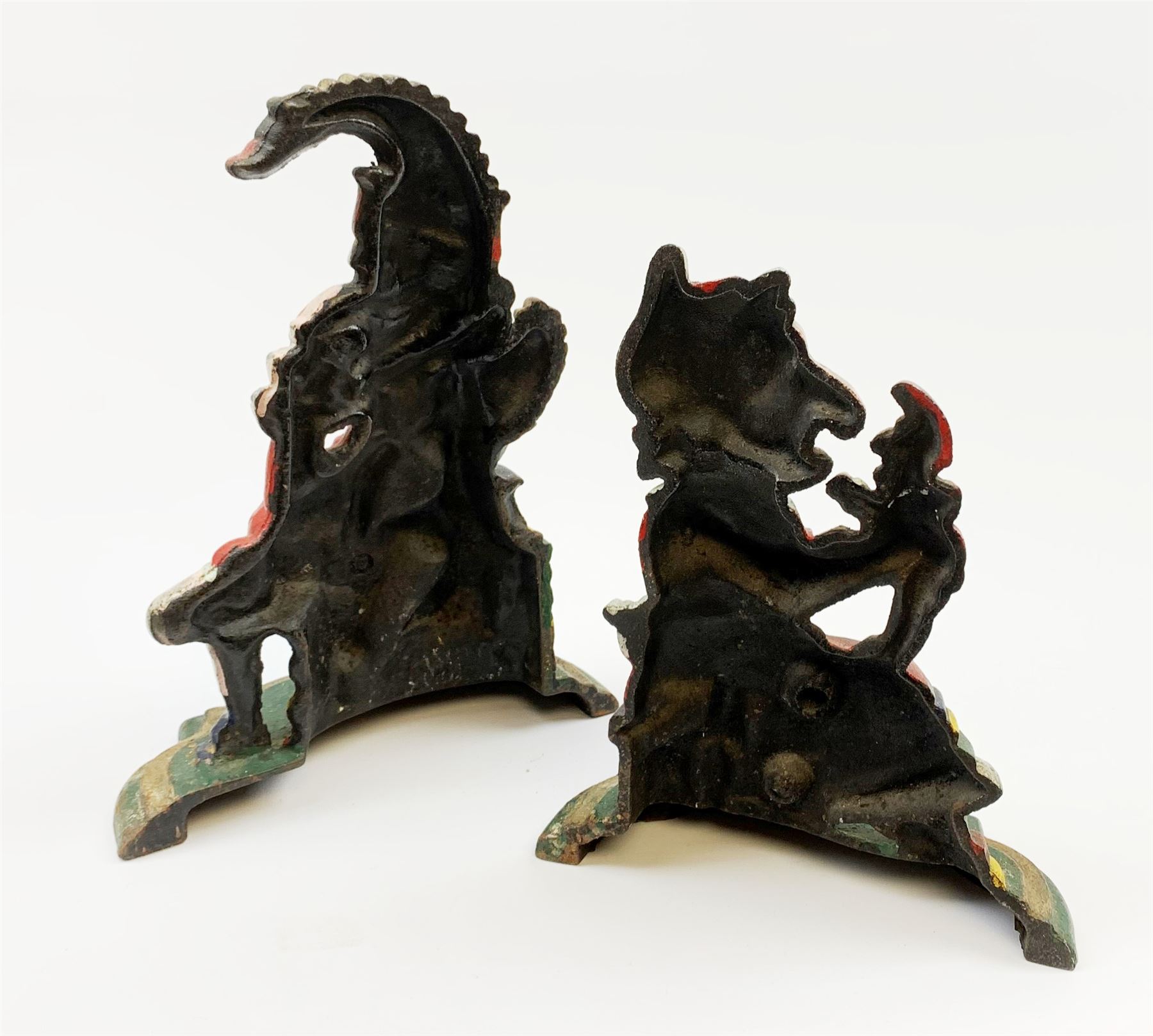 A pair of Victorian cast iron doorstops modelled as Punch and Judy