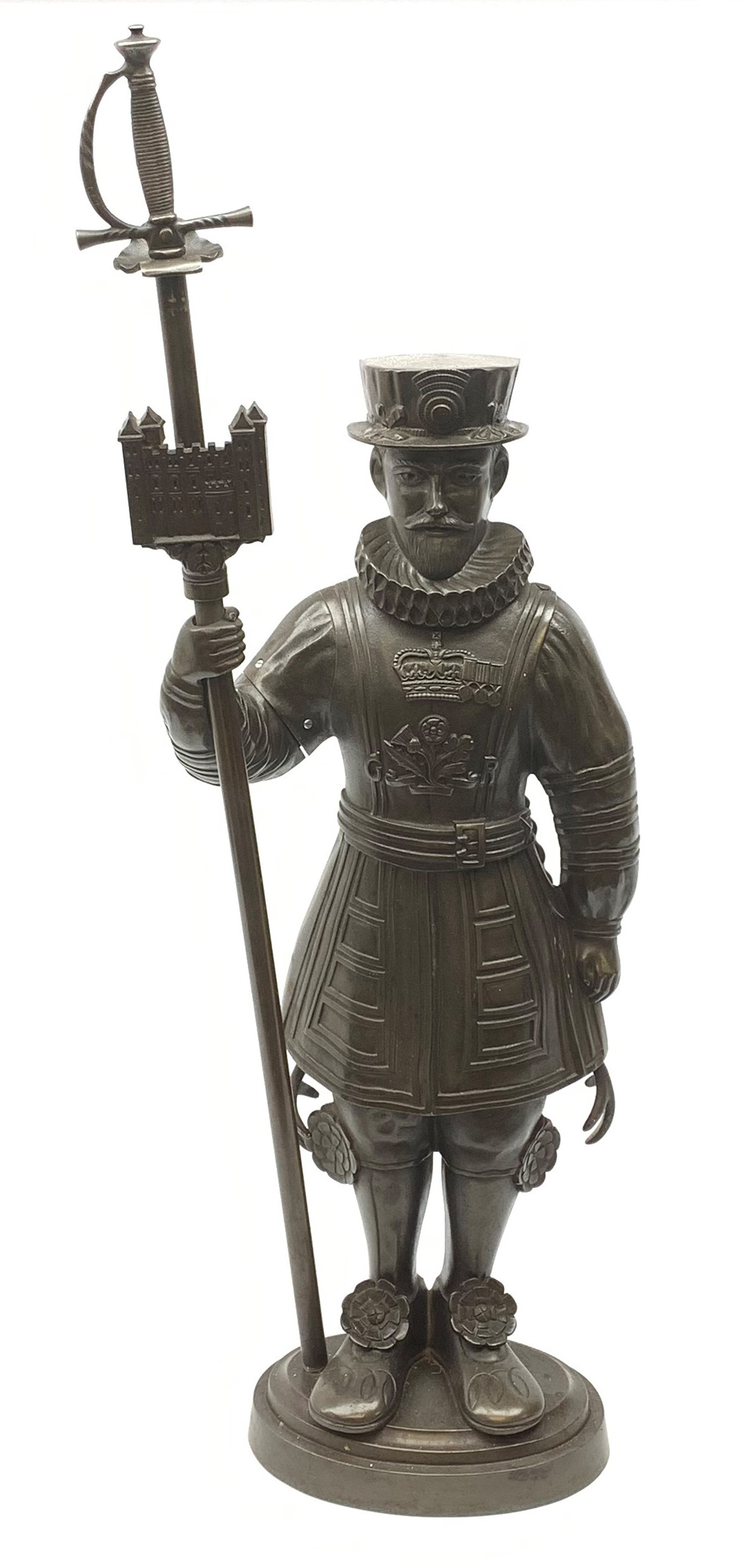 A cast iron figural companion set modelled as a Beefeater, H83cm. 
