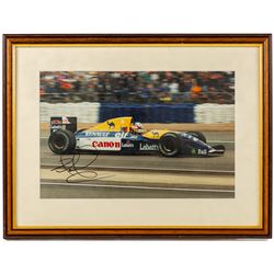 Ten signed Formula 1 photographs, comprising eight Damon Hill examples, Jenson Button and a Nigel Mansell example, nine with certificates of authenticity from Write Stuff Autographs, all framed, largest H47cm, W67cm