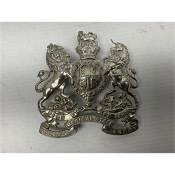 Victorian Volunteer Medical Staff Corps white metal helmet plate in the form of Victorian crowned Royal Arms with three part lower scroll for “VOLUNTEER MEDICAL STAFF CORPS”; three lug fittings to the reverse L8.5cm