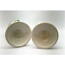 A pair of Clarice Cliff Newport Pottery vases, of tall ribbed conical form decorated in relief with two budgerigars, with printed marks beneath, H31.5cm. 