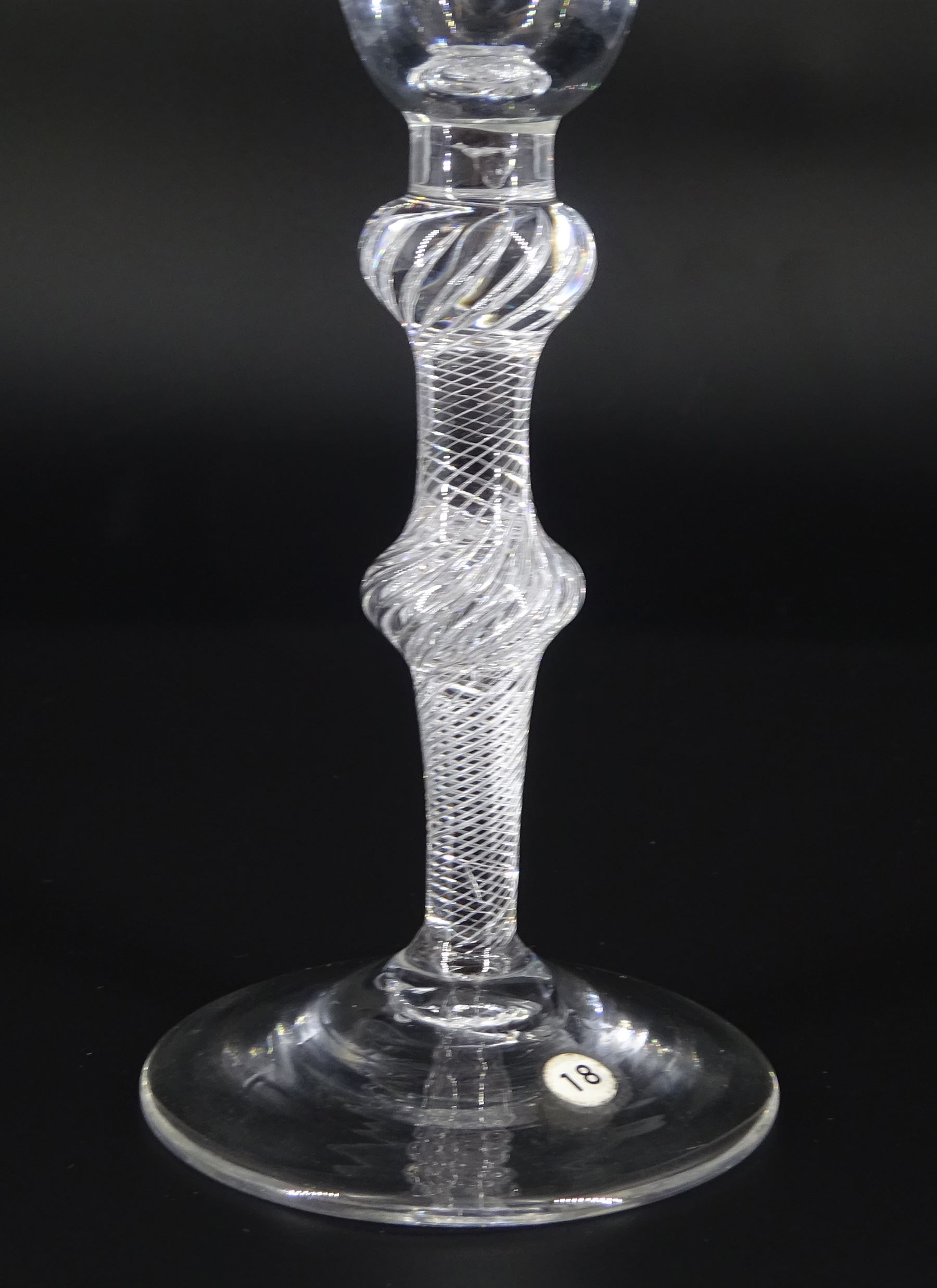 Mid 18th century wine glass, the funnel bowl engraved with fruiting vines upon a single series air twist double knopped stem and conical foot, H16.5cm