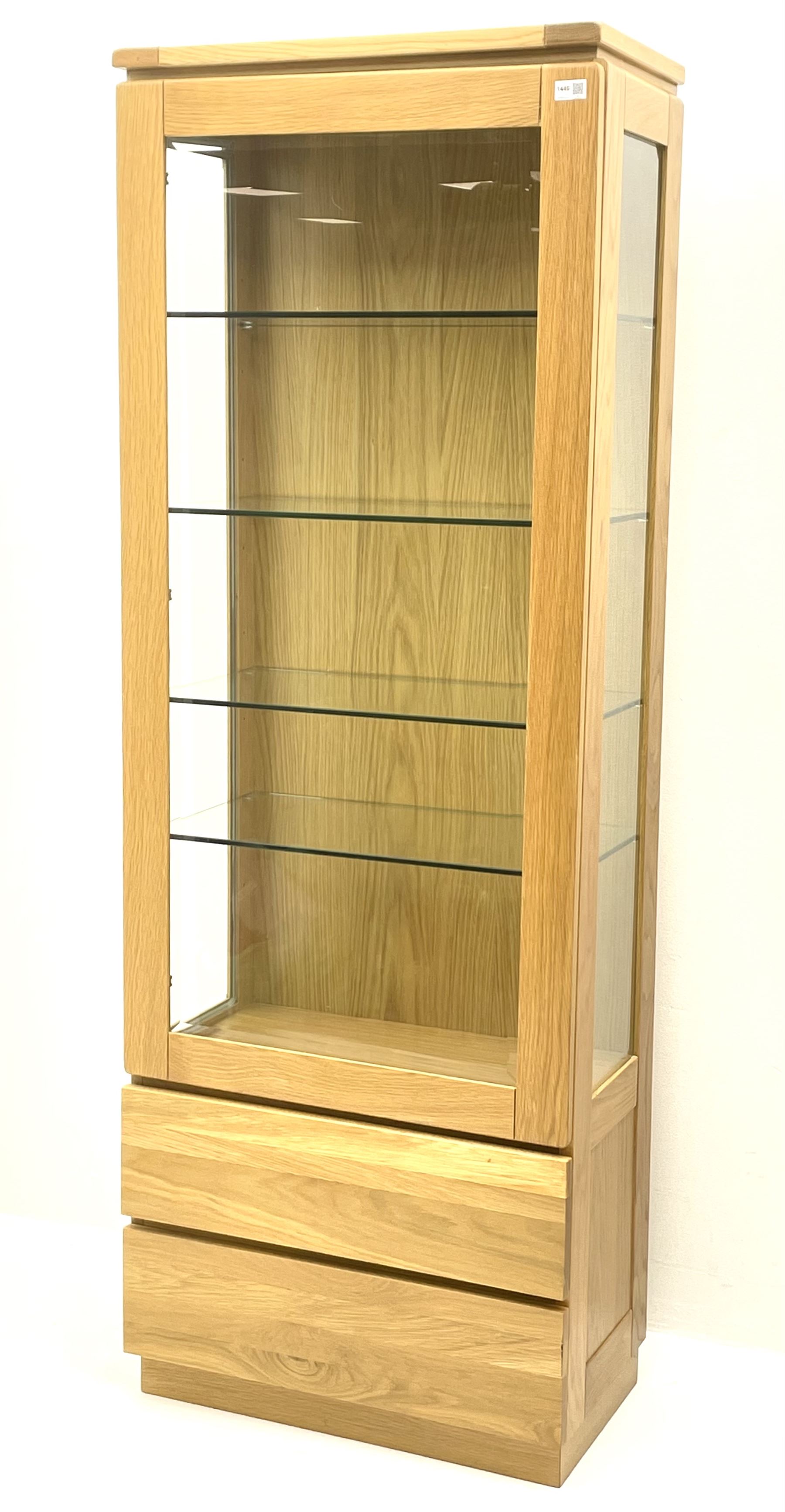 Solid light oak glazed display fitted with two base drawers