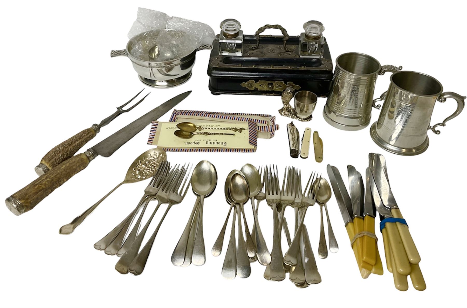 Victorian ebonised wooden desk stand, with brass mounts and two glass inkwells, together with two pewter tankards with Masonic engravings, two pewter quaiches, horn handled carving set, the fork with silver mounts and a collection of other metalware