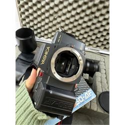 Yashica 230-AF camera outfit, including camera body serial no. 0184693, three Yashica lenses comprising AF 70-200mm 1:4.5 serial no. F6162003, AF 28-85mm 1:3.5-4.5 macro lens serial no. F6225564 and an AF 75-300mm 1:4-5.6 Macro lens serial no. F7100913, flash, hood and other accessories and instruction booklet, contained within a silver flight case 