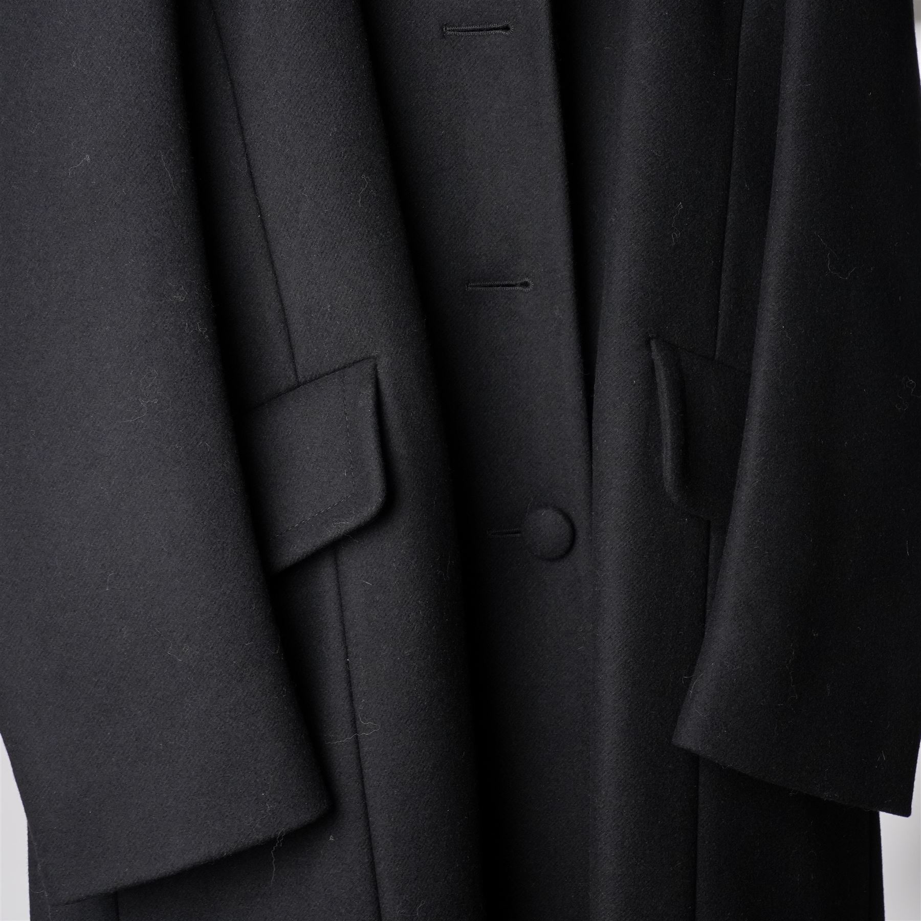 Prada - black Melton wool coat, in a redingote style with front fastening and fabric-covered buttons, flap pockets and a structured collar with slit to the back, size 44, unused with the original garment bag and hanger
