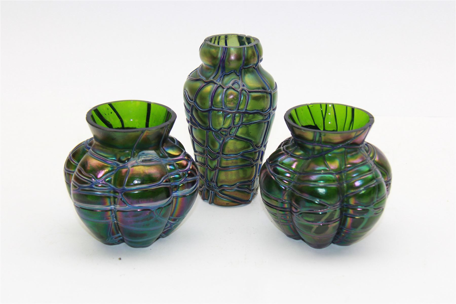 Three Austrian Art Nouveau Kralik iridescent glass vases, to include two of squat baluster form and a taller example, all green with threaded vein decoration to body, tallest H13.5cm