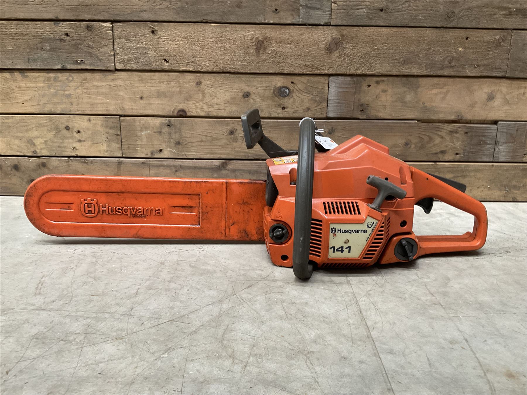 Husqvarna 141 petrol chainsaw and a Husqvarna 226HD75S petrol hedge cutter