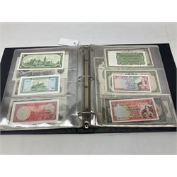 World banknotes, including Queen Elizabeth II The States of Jersey one pound 'DB202703', five pounds 'BB527762' and ten pounds 'AB651481', reserve bank of New Zealand two dollars '1L3 741894', King George V Straits Settlements one dollar 1st January 1935 'F/83 28924', various Bank of England notes etc, housed in two ring binder albums
