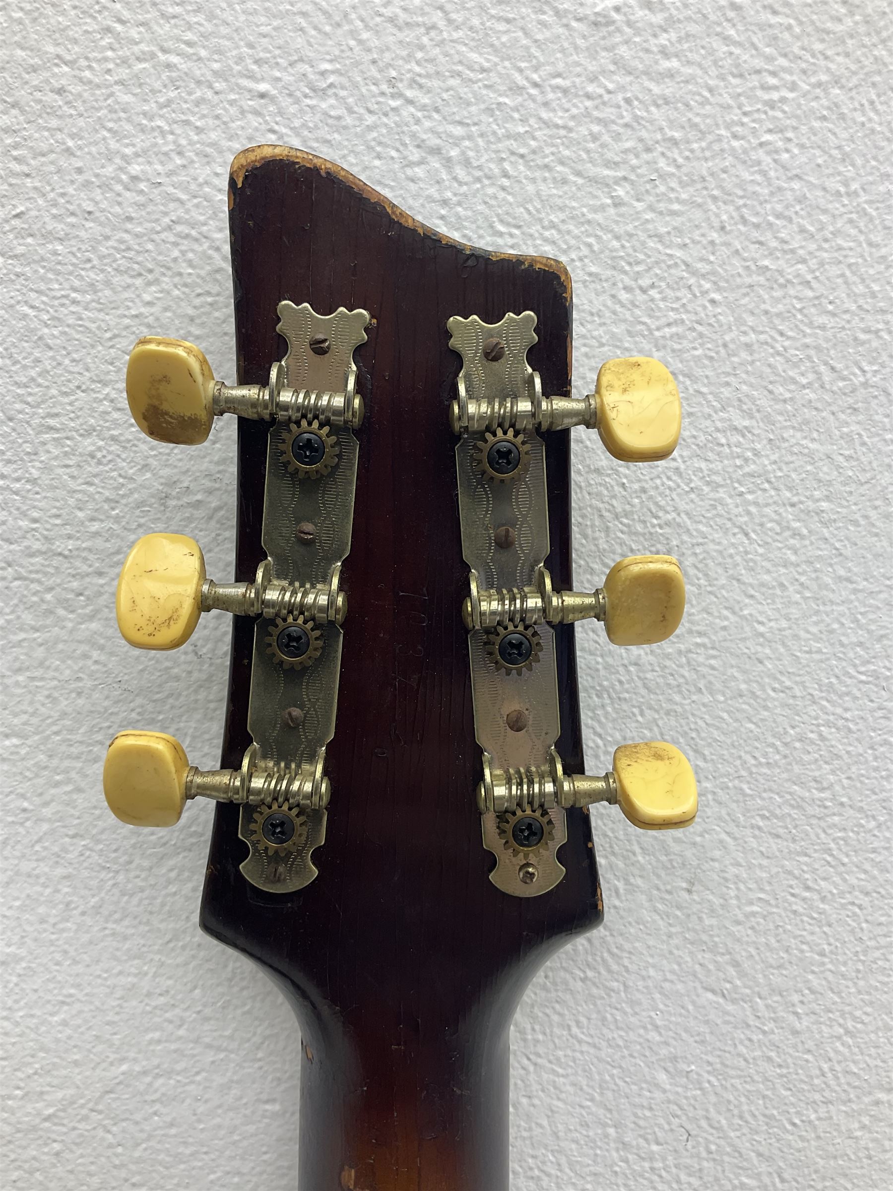 1950s Framus arch top acoustic guitar with sunburst finish and Framus logo to top, No.1937 L104cm; in hard carry case.