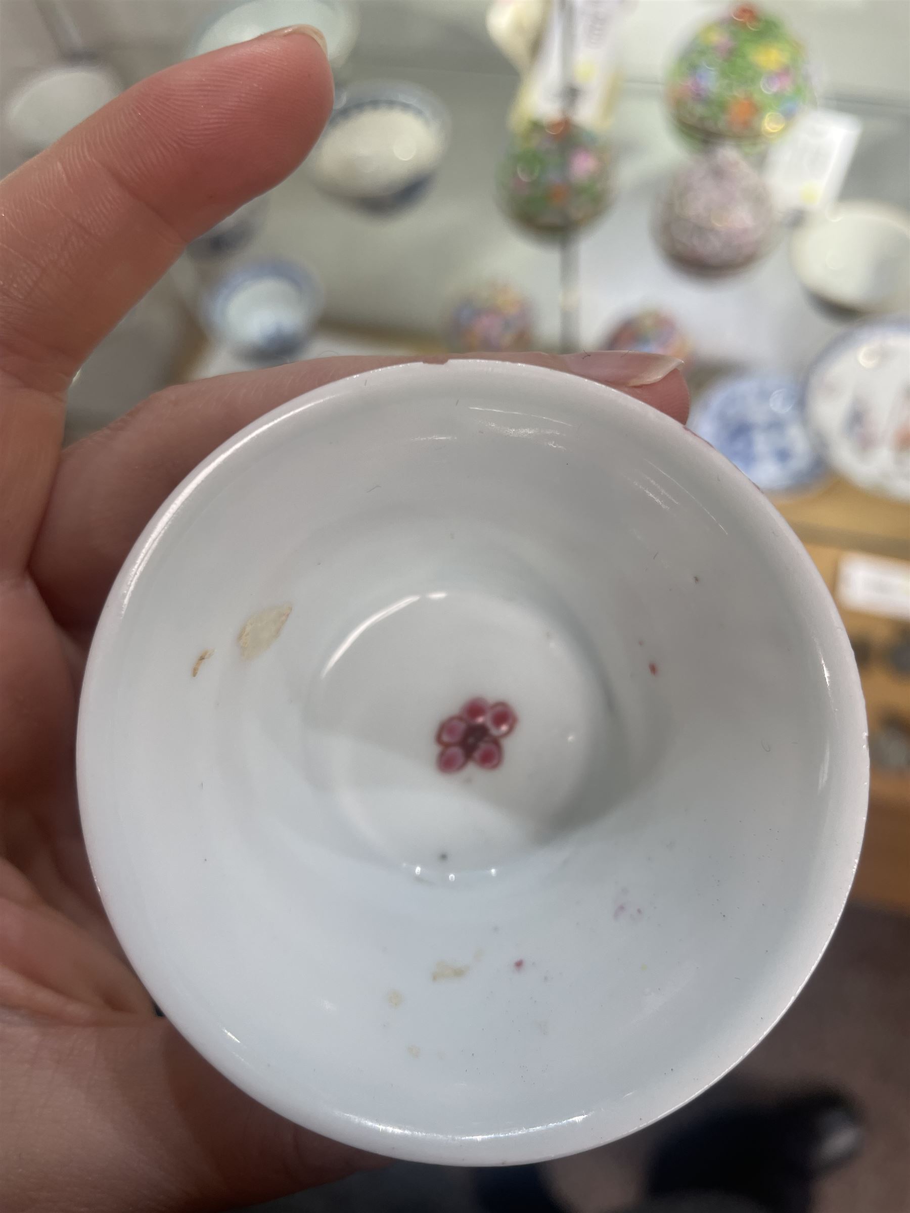 Group of eight 18th century and later Chinese famille rose and similar painted teabowls and dishes, to include unmarked peony cup, small cup decorated with flowers and butterfly, cup decorated with female figure gazing out of a window in a Buddhist temple with indistinct square character mark to base, pair of saucers unmarked, and others with character scenes unmarked (8)