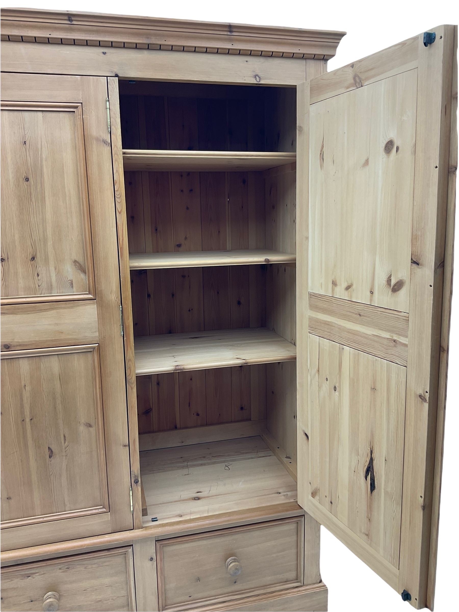 Solid pine triple wardrobe with three drawers