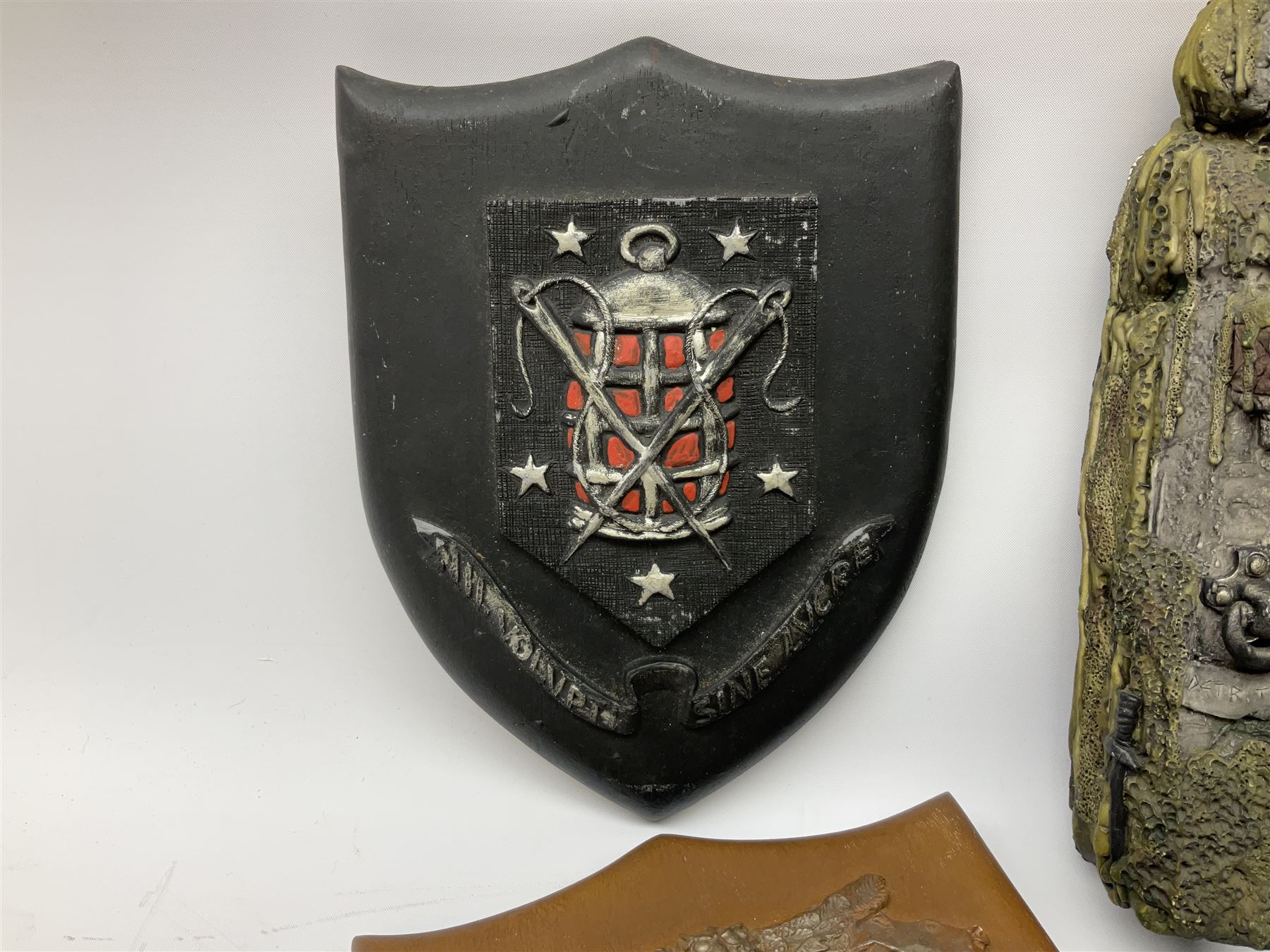 Terry Pratchett Discworld plaques, designed by Clarecraft, comprising 'the First Discworld Event Clarecraft August 95', the collectors guild joining shield, the fools guild DW99C, the seamstresses guild DW98C, the musicians guild DW00C together with 'Door of the mended drum' wall hanging DW17. 