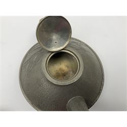 Archibald Knox for Liberty & Co Tudric pewter three piece tea service, comprising teapot with woven reed handle, single handled open sucrier, and milk jug, each with planished finish and detailed with honesty flowers, each impressed beneath Made in England Tudri Pewter 0231 