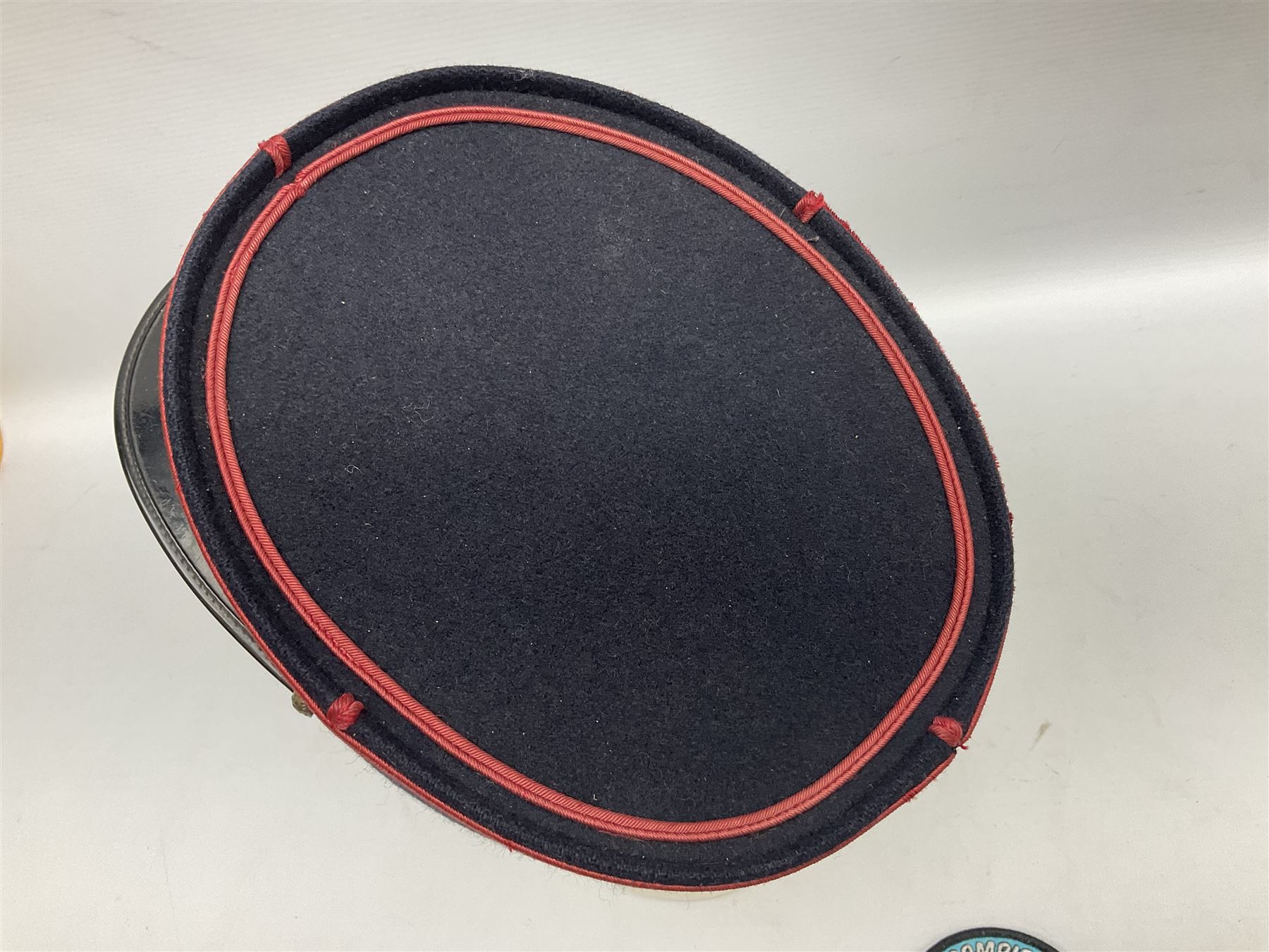 Mid 20th century French Ugeco Nantes first class dress navy blue uniform with ribbon bar with cap, and quantity of Sapeurs Pompiers patches, Sapeurs Pompiers de Caen belt buckle etc