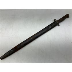 British Pattern 1907 bayonet, the 43.5cm fullered steel blade marked 'Wilkinson'; in steel mounted leather scabbard L57.5cm overall