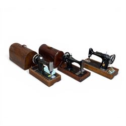 Three Singer wooden cased sewing machines 