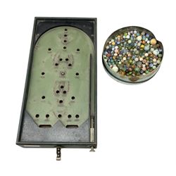 Quantity of vintage glass marbles and bagatelle board, L55cm