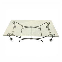 In the manner of Maison Jansen - Regency inspired glass and wrought metal coffee table with scrolling X-form base