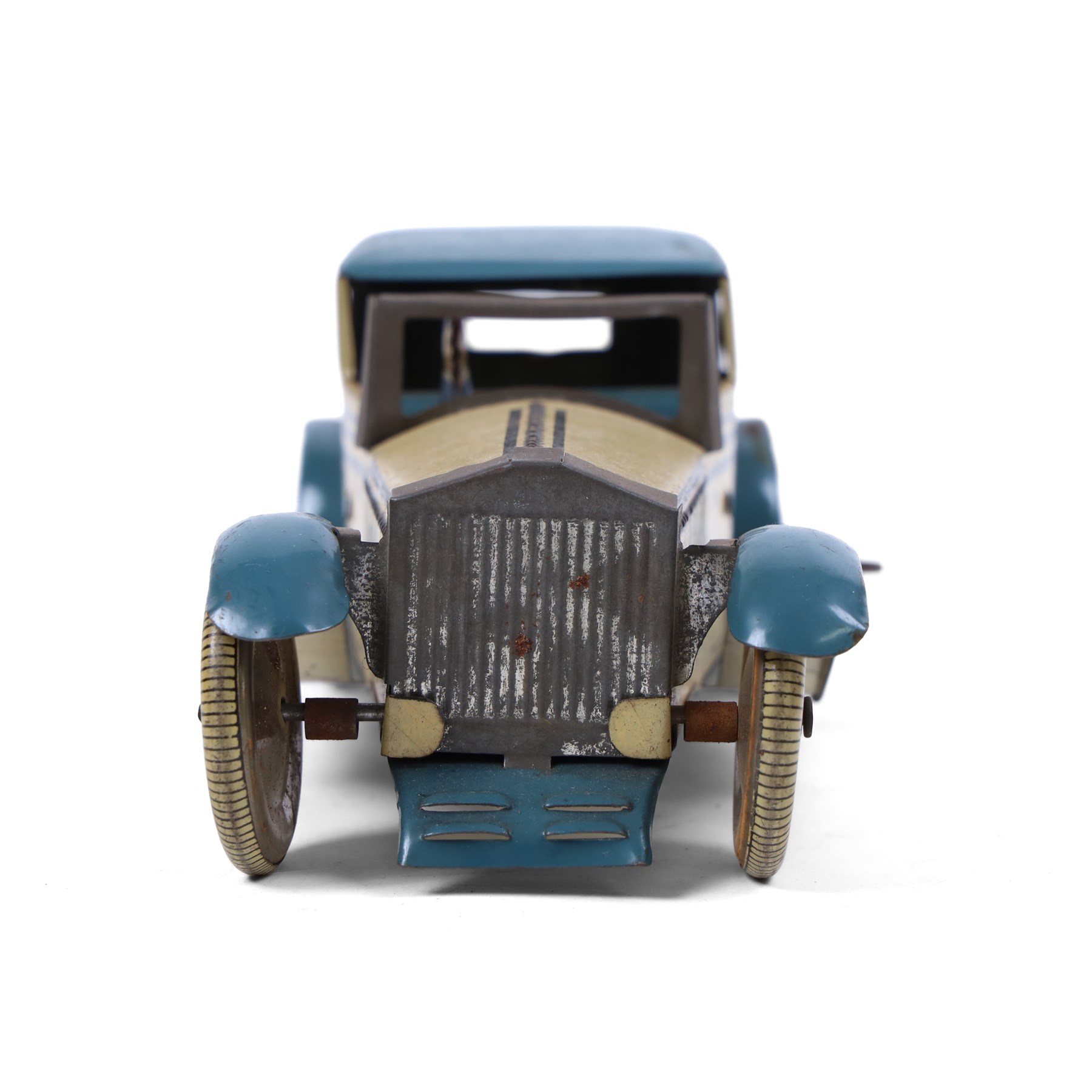 Wells tinplate clockwork limousine, the cream body, with blue roof and lithographed details, with driver and key, H8cm, L23cm