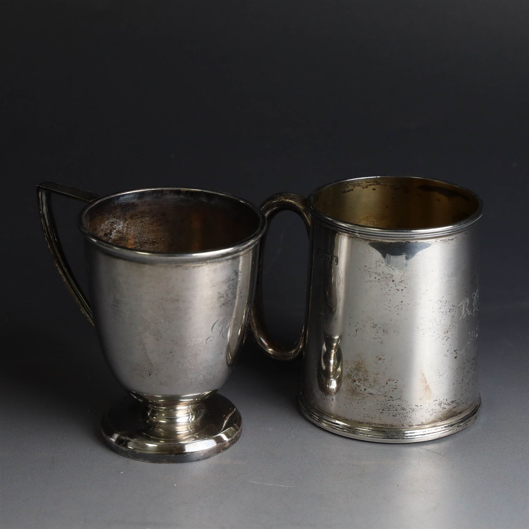 Two early 20th century silver christening mugs, both with engraved initials, both hallmarked, tallest H7.5cm