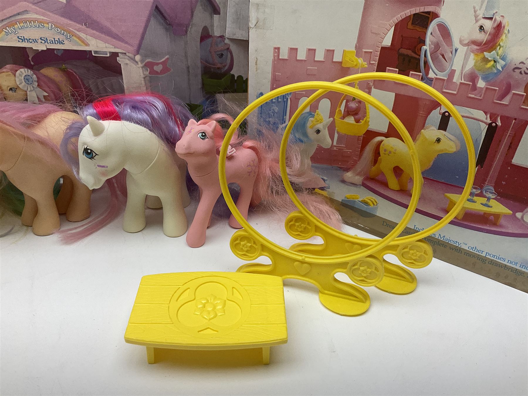 1980s Hasbro My Little Pony - Dream Castle and Show Stable; both boxed, together with Lullaby Nursery and Carry Case; ten generation one ponies, including Majesty, Skydancer and Locket; and assorted accessories 