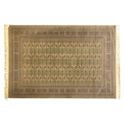 Turkish Bokhara design rug, olive green field decorated with an all-over design of repeati...