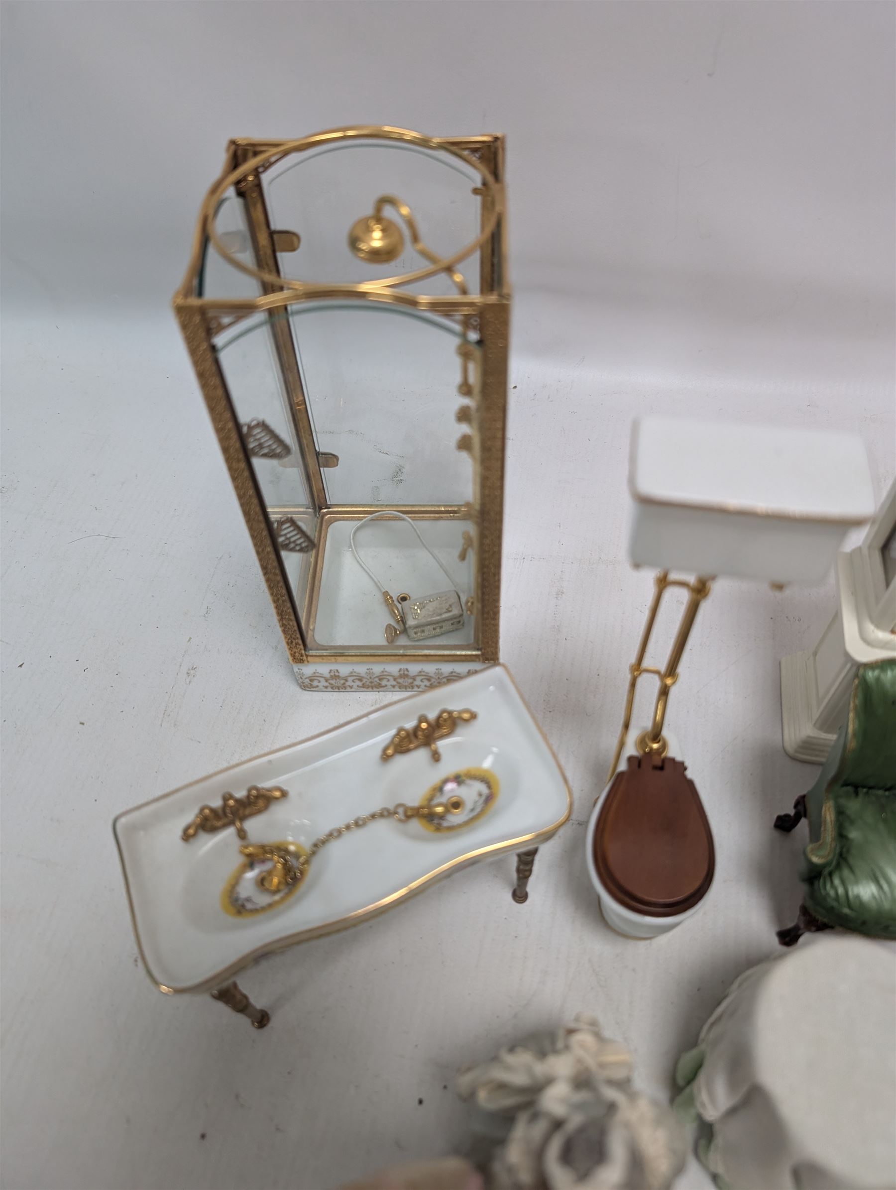 Dolls house bathroom and bedroom furniture, including bed, wardrobe, dresser filled with toiletries, shower, five figures, etc 