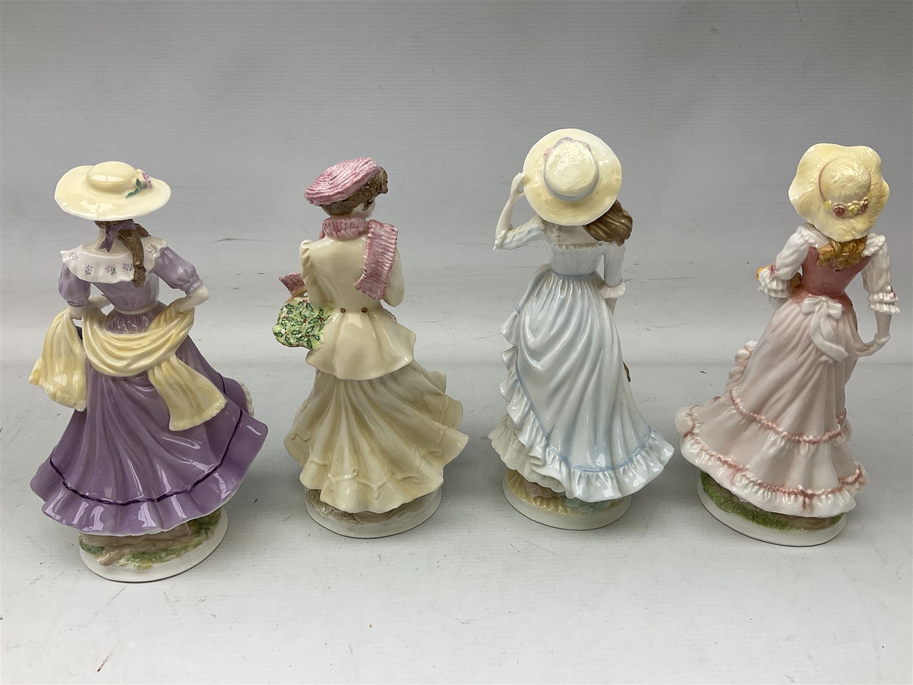 Set of four Royal Worcester limited edition figures, from the Four Seasons collection, comprising Spring, Summer, Autumn and Winter, with printed mark beneath 