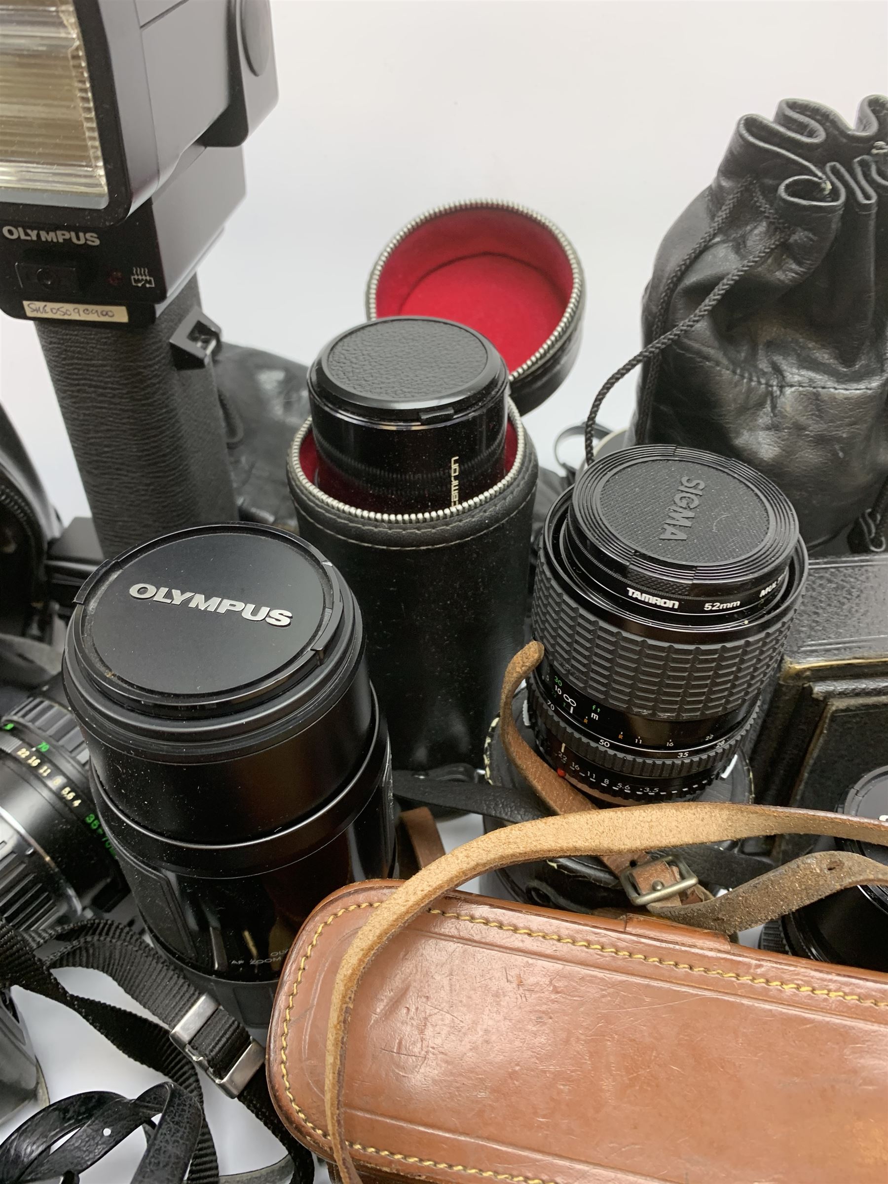 Vintage cameras lenses and accessories including Olympus 'OM10' camera body, Olympus 'OM4' camera, 'Olympus OM-System Zuiko auto-zoom 35-70mm 1:4' lens, various other lenses, tasco binoculars etc, in one box
