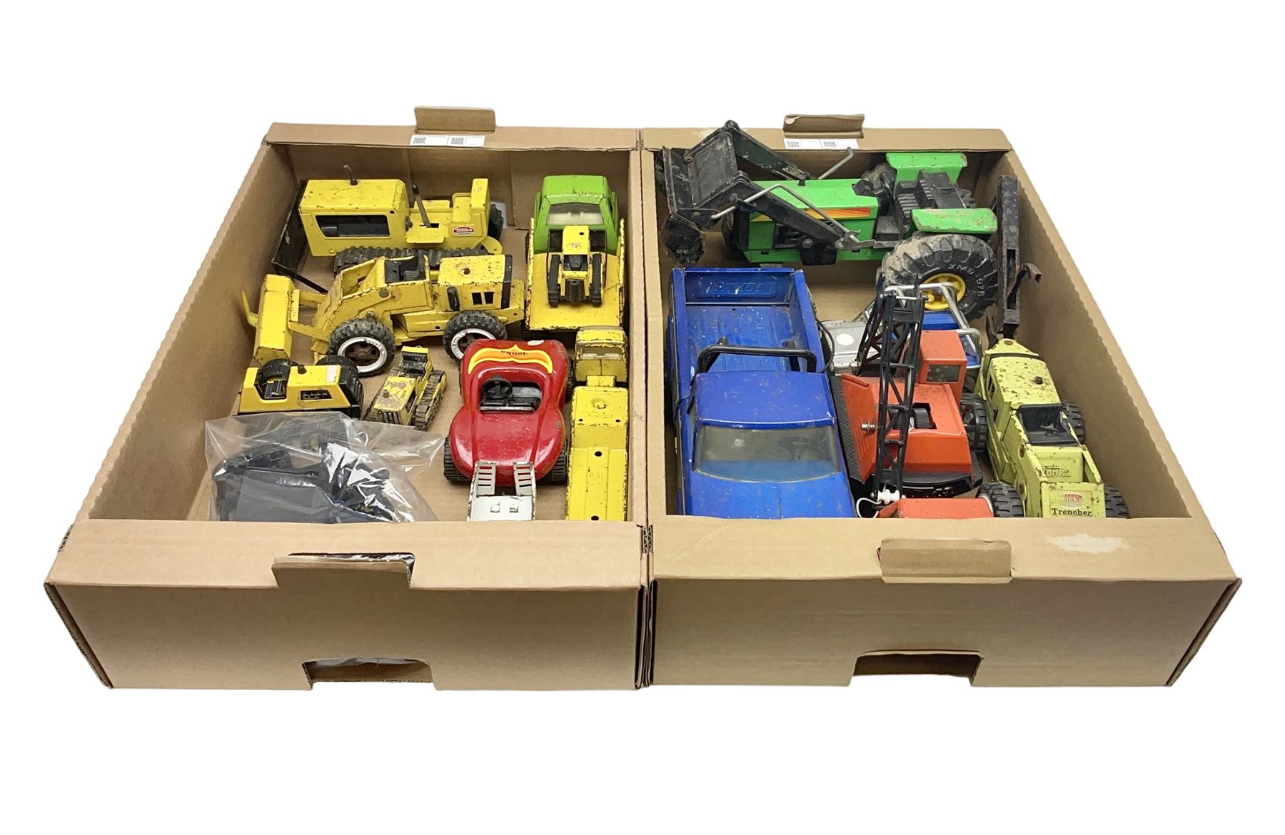 Tonka - fourteen pressed steel vehicles including Pick-up Truck, Tractor Digger, Mobile Crane, Trencher, Beach Buggy, two Bulldozers, Digger, Low Loader, Farm Trucks etc; and small quantity of spare parts (14)