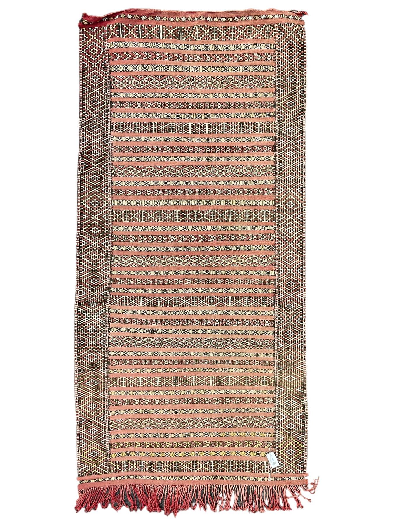 Moroccan Berber rug, pale red ground, decorated with horizontal geometric pattern bands, lozenge pattern upright bands