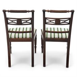Pair of 19th century mahogany dining chairs, the wrythen top rail above a pierced splat and reeded side supports, above a white and green upholstered drop in seat, upon turned and reeded front and plain back legs
