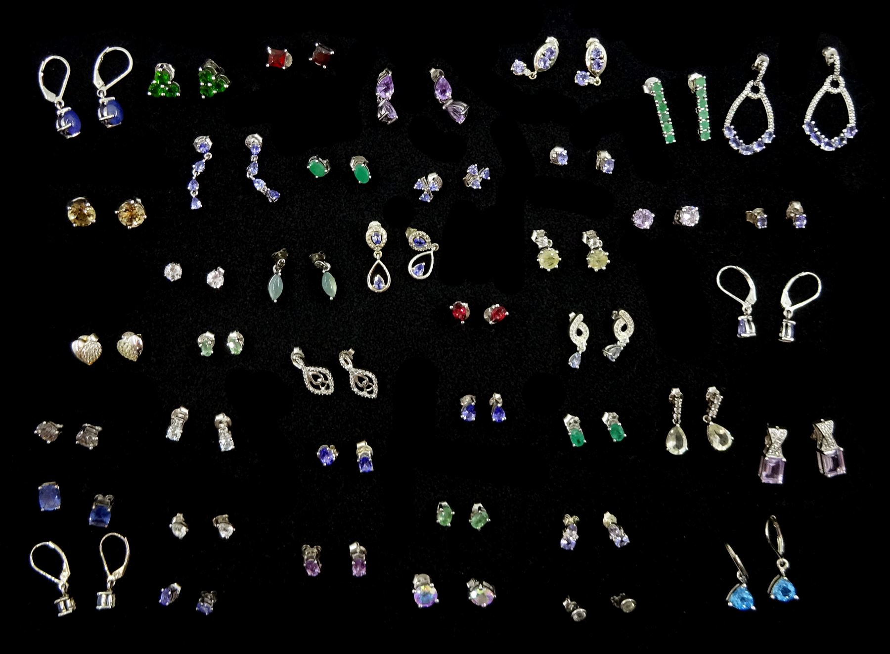 Forty-one pairs of silver stone set stud earrings including tanzanite, topaz, amethyst, quartz, chrome diopside and garnet